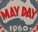 A badge celebrating May Day.