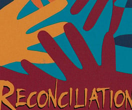 'Reconciliation, it's up to us' badge.