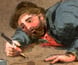 Painting showing a prospector picking small nuggets out of a digging.