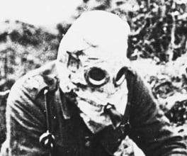 Photograph of soldiers in gas masks.